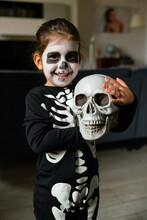 Happy Little Skeleton With Skull