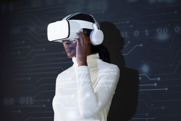 Wall Mural - African American woman with virtual reality glasses smart technology