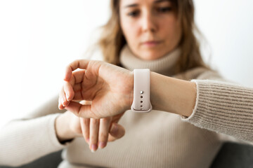 Woman looking at smartwatch wearable technology