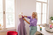 © Mihajlo Ckovric/Stocksy - Fashion designer working in studio