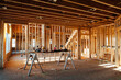 © Jessica Klaus/Stocksy - New home construction of kitchen.