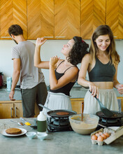 Girls Prepare Food And Dancing In The Kitchen