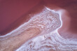 © INIGO CIA DA RIVA/Stocksy - Colorful abstract background of pink salt lake