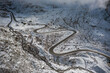 © plpictures by Paedii Luchs/Stocksy - Aerial view of winding mountain road