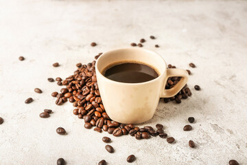 Cup of hot coffee on light background