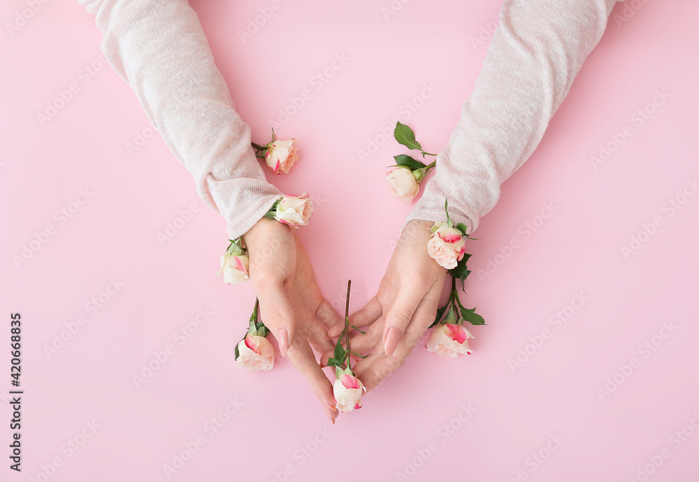 Female hands with beautiful flowers on color background - obrazy, fototapety, plakaty 