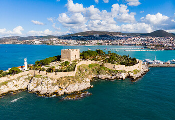 View of Guvercinada or Pigeon Island in the Aegean Sea with the Kusadasi Pirate castle in summer day, Turkey