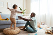 © BONNINSTUDIO/Stocksy - Playful girl with mother having fun at home