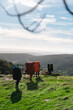 © Manu Prats/Stocksy - Group of mountaineers hiking on green hill