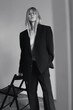 © Hamza Kulenović Photography/Stocksy - Artistic and fashion photo of a blonde girl with nice clothes in room.