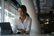 © Prathankarnpap - Beautiful young female holding credit card and using tablet computer for online shopping or internet banking.