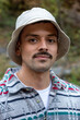 © Bisual Studio/Stocksy - Portrait of young man with mustache