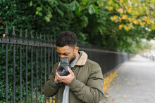Man Taking Pictures With A Medium Format Camera