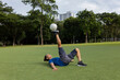 © Felix Hug/Stocksy - Freestyle footballer in Park balancing the ball on his sole