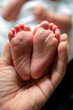 © Cara Dolan/Stocksy - Baby Feet Up Close