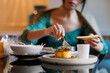 © Studio Firma/Stocksy - An Asian Woman in a Restaurant