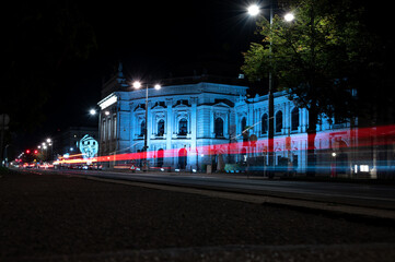 Wall Mural - Night city. Road with light trails. City street at night with light streaks from vehicles