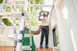 © Jennifer Bogle/Stocksy - Father and son building playhouse