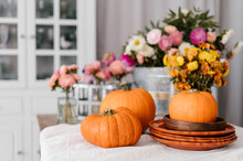 Flowers And Pumpkins In Dining Room
