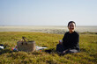 © ChaoShu Li/Stocksy - Pretty Asian women on outdoor picnic during the journey