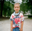 © Jakob Lagerstedt/Stocksy - Cute young boy wearing a tie-dye shirt