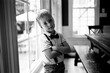 © Jakob Lagerstedt/Stocksy - Cute young boy wearing suspenders and a bowtie