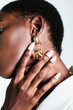 © BONNINSTUDIO/Stocksy - Crop black woman in stylish earrings