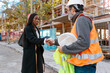 © Jimena Roquero/Stocksy - Woman engineer shaking hand with construction foreman of building in development