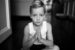 © Jakob Lagerstedt/Stocksy - Cute young boy pressing his palms together