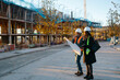 © Jimena Roquero/Stocksy - Woman engineer supervising construction of building with construction worker