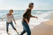 © Valentina Barreto/Stocksy - Mature couple propose at the fall beach morning