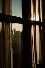 View Of Sunset Behind A Window