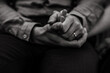 © Melissa Milis Photography/Stocksy - monochrome image of two people holding hands
