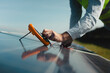 © Videophilia Stock/Stocksy - An Engineer checking the Solar panel in the Solar Energy field - Close up