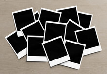 Stack Of Instant Photos Mockup. Pile Of Retro Photographs On Wooden 3D Rendering