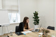 © Oleksii Syrotkin/Stocksy - Business lady at meeting