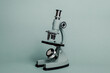 © Vera Lair/Stocksy - Small Microscope On A Blue background