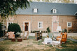 © Melissa Milis Photography/Stocksy - Outdoor space with vintage chairs