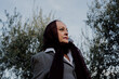 © Eloisa Ramos/Stocksy - Portrait of senior woman with a veil on her head in a flamenco attitude in an olive grove