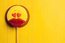 Candy In The Form Of A Smiley On A Stick Candy Marmalade Sweets Yellow Wooden Background