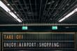 © Alina Hvostikova/Stocksy - Signboard and exit signs in airport