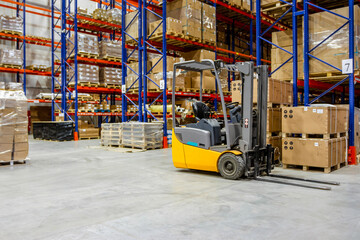 Wall Mural - Interior of a modern warehouse storage of retail shop with forklift near shelves