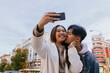 © MyMicrostock/Stocksy - Chinese young couple taking a selfie