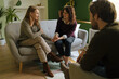 © Ivan Ozerov/Stocksy - Happy lesbian couple in psychotherapist office