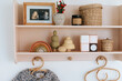 © Melissa Milis Photography/Stocksy - Pink little shelf with kids stuff
