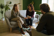 © Ivan Ozerov/Stocksy - Happy lesbian couple visiting therapist