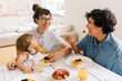 © (JLco) Julia Amaral - Female couple with son having breakfast