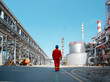 © Videophilia Stock/Stocksy - A worker in the oil refinery