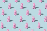 Fototapeta Boho - Easter pattern made with easter bunny on blue background. Creative minimal holiday concept. Flat lay, top view