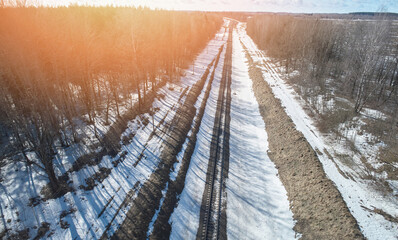 Railroad path in winter landscape